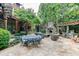 Elegant flagstone patio with outdoor fireplace and dining area at 879 Big Horn Hollow, Suwanee, GA 30024