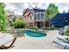 Resort style pool with expansive patio and stylish lounge chairs at 879 Big Horn Hollow, Suwanee, GA 30024