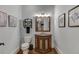 Elegant powder room with ornate vanity, and framed artwork at 879 Big Horn Hollow, Suwanee, GA 30024
