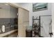 Home sauna featuring wooden paneled walls and door and shelving with towels at 879 Big Horn Hollow, Suwanee, GA 30024