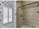 Large walk-in shower with tile surround and built-in shelving at 879 Big Horn Hollow, Suwanee, GA 30024