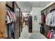 Large walk-in closet with ample shelving and hanging space at 879 Big Horn Hollow, Suwanee, GA 30024