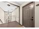 View of a carpeted entrance hall leading to stairs, next to a suite entrance with a private residence sign at 1538 Chantilly Ne Dr # 224, Atlanta, GA 30324