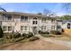 Condo exterior with gray siding, arched window, and green landscaping at 1538 Chantilly Ne Dr # 224, Atlanta, GA 30324