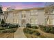 Exterior of a two-story condo building with a landscaped lawn and a pathway leading to the front door at 1538 Chantilly Ne Dr # 224, Atlanta, GA 30324
