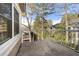 Outdoor patio with metal railing overlooking wooded area at 1538 Chantilly Ne Dr # 224, Atlanta, GA 30324
