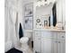 Simple bathroom with a tub, toilet and vanity at 703 Hammond Dr, Woodstock, GA 30188