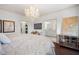 Main bedroom with ensuite bathroom and hardwood floors at 703 Hammond Dr, Woodstock, GA 30188