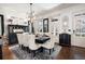 Bright dining room with large table and chandelier at 703 Hammond Dr, Woodstock, GA 30188