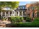 View of home's back showing the porch and landscaping at 703 Hammond Dr, Woodstock, GA 30188