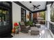 Relaxing front porch with rocking chairs and ceiling fan at 703 Hammond Dr, Woodstock, GA 30188