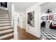 Bright hallway with hardwood floors and access to rooms at 703 Hammond Dr, Woodstock, GA 30188