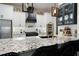 Modern kitchen with granite countertops and white cabinets at 703 Hammond Dr, Woodstock, GA 30188