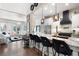 Open kitchen with island, breakfast bar, and stainless steel appliances at 703 Hammond Dr, Woodstock, GA 30188