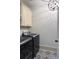 Laundry room with washer, dryer and patterned floor at 703 Hammond Dr, Woodstock, GA 30188