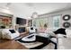 Bright living room featuring a fireplace and hardwood floors at 703 Hammond Dr, Woodstock, GA 30188