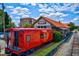 Quirky restaurant showcasing a train car alongside the building, offering a unique dining experience at 703 Hammond Dr, Woodstock, GA 30188