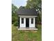Charming backyard playhouse with traditional finishes at 1368 New Hope Rd, Lawrenceville, GA 30045