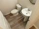 Clean half bathroom with modern fixtures and neutral tones at 3978 Lake Manor Way, Atlanta, GA 30349