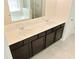 The bathroom features a double vanity with dark wood cabinets and a light tile floor at 3978 Lake Manor Way, Atlanta, GA 30349