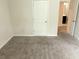 Bedroom featuring neutral walls, carpet and a closet at 3978 Lake Manor Way, Atlanta, GA 30349