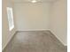This bedroom has neutral walls, carpet and trim and ample natural light at 3978 Lake Manor Way, Atlanta, GA 30349