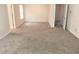 This bedroom has neutral walls, carpet and trim and ample natural light and two doorways at 3978 Lake Manor Way, Atlanta, GA 30349