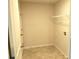 Tiled walk in closet with wire shelving at 3978 Lake Manor Way, Atlanta, GA 30349