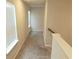 This hallway has carpeted floors, natural light, and white trim at 3978 Lake Manor Way, Atlanta, GA 30349