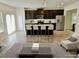 Eat-in kitchen boasts dark cabinets and stainless steel appliances at 3978 Lake Manor Way, Atlanta, GA 30349