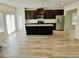 Kitchen with island, stainless steel appliances, and dark cabinetry at 3978 Lake Manor Way, Atlanta, GA 30349