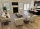 Bright, staged living room with fireplace and open layout at 3978 Lake Manor Way, Atlanta, GA 30349