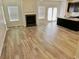 Open-concept living room featuring a fireplace and lots of space at 3978 Lake Manor Way, Atlanta, GA 30349