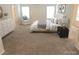 Staged primary bedroom with carpet floors and lots of natural light at 3978 Lake Manor Way, Atlanta, GA 30349