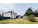 Exterior view of the home and backyard with mature trees at 2717 Kristen Ct, Conyers, GA 30012