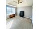 A well-lit bedroom with neutral carpeting, trey ceiling, and a ceiling fan at 2717 Kristen Ct, Conyers, GA 30012