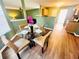 Cozy dining area with a glass table and hardwood flooring adjacent to the kitchen at 2717 Kristen Ct, Conyers, GA 30012