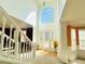 Grand foyer with a large window, gleaming hardwood floors, a white staircase, and elegant decor at 2717 Kristen Ct, Conyers, GA 30012