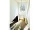 Bright foyer with a soaring window, light wood floors, and a grand staircase with white banisters at 2717 Kristen Ct, Conyers, GA 30012