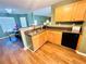 Kitchen area featuring granite counters, modern appliances, and adjacent dining space at 2717 Kristen Ct, Conyers, GA 30012