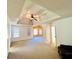 Living Room featuring a vaulted trey ceiling, neutral carpeting, and lots of natural light at 2717 Kristen Ct, Conyers, GA 30012