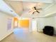 Living Room featuring a vaulted trey ceiling, neutral carpeting, and lots of natural light at 2717 Kristen Ct, Conyers, GA 30012