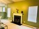 Bright living room boasts fireplace, plush carpeting, and ample natural light with views from the windows at 2717 Kristen Ct, Conyers, GA 30012