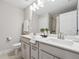 Modern bathroom with double sink vanity, framed mirror, and tile shower at 802 Oak Promenade Ln, Canton, GA 30115