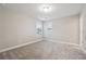 Neutral bedroom with plush carpet, bright natural light, and painted walls at 802 Oak Promenade Ln, Canton, GA 30115