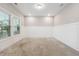 Bright bedroom features neutral walls, plush carpeting and natural light from the large double-hung windows at 802 Oak Promenade Ln, Canton, GA 30115