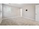 Bedroom with neutral walls, carpet, mounted flatscreen, and a closet at 802 Oak Promenade Ln, Canton, GA 30115