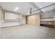 This garage offers generous space, ample storage, and a convenient workbench for projects at 802 Oak Promenade Ln, Canton, GA 30115