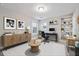 Inviting office space with modern furniture, built-in shelving, and stylish decor at 802 Oak Promenade Ln, Canton, GA 30115