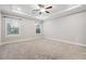 Main bedroom features neutral walls, plush carpeting and tray ceilings at 802 Oak Promenade Ln, Canton, GA 30115